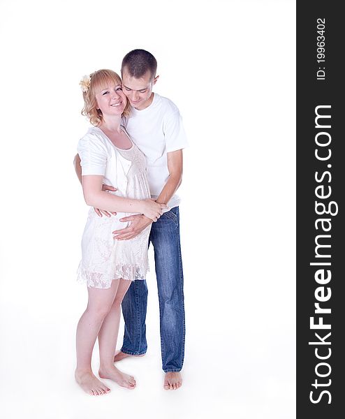 Studio shot of young couple expecting a baby