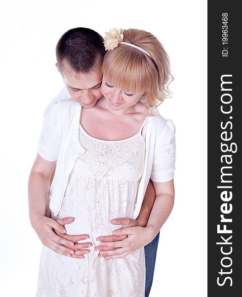 Studio shot of young couple expecting a baby