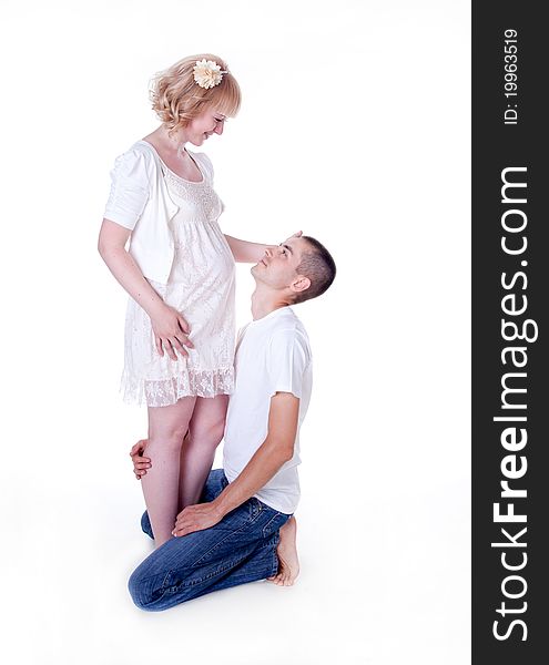 Studio shot of young couple expecting a baby