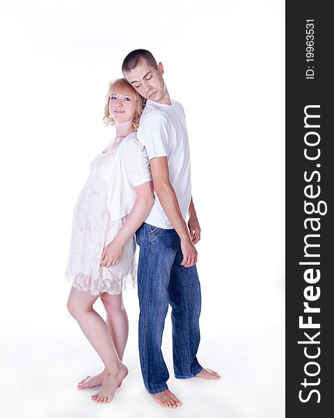 Studio shot of young couple expecting a baby