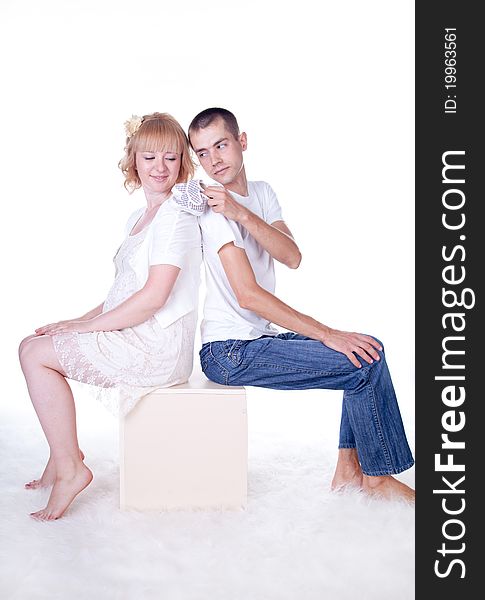 Studio shot of young couple expecting a baby