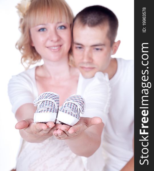 Studio shot of young couple expecting a baby