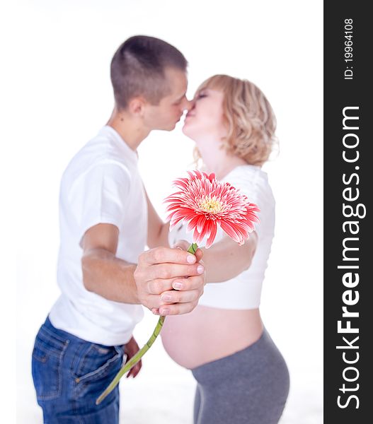 Studio shot of young couple expecting a baby