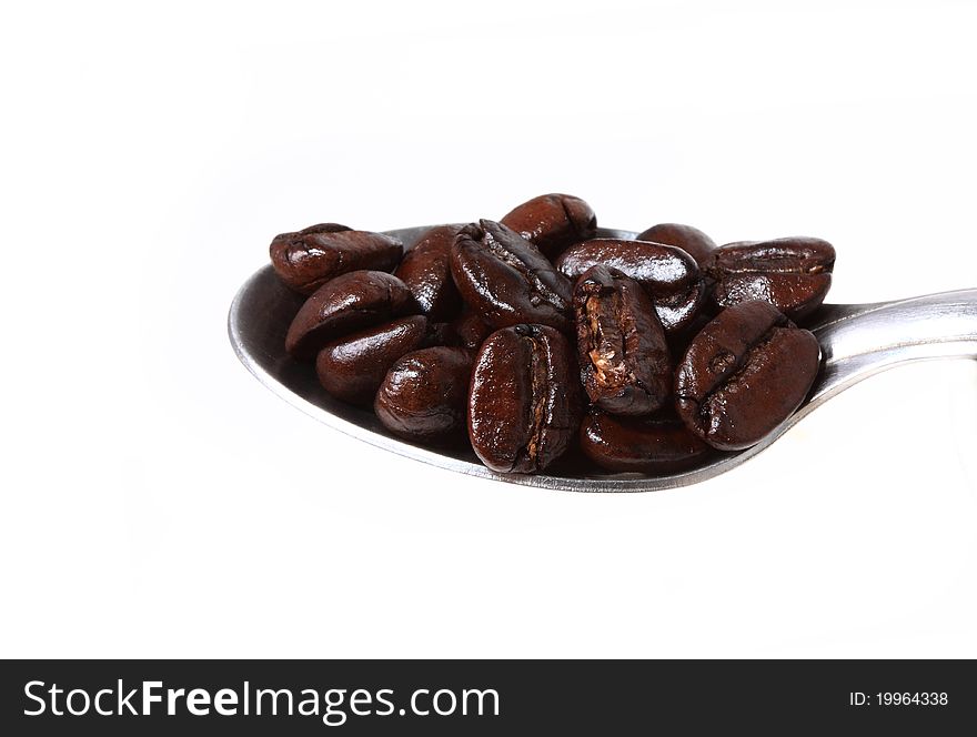 An arrangement of coffee beans on a white background