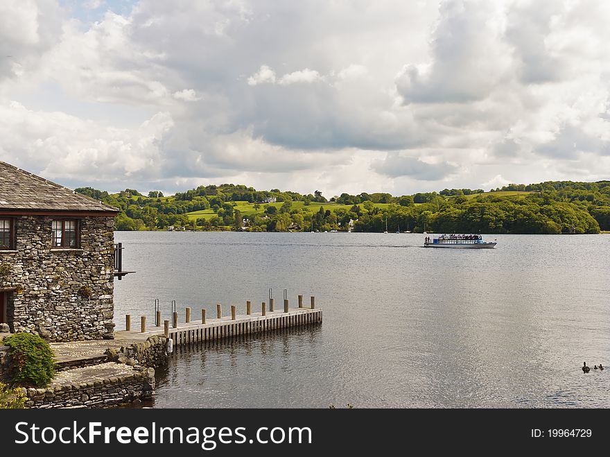 A stone built house on the edge of a lake. A stone built house on the edge of a lake