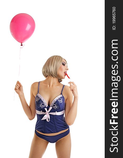 Beauty woman in lingerie with balloons lick candy