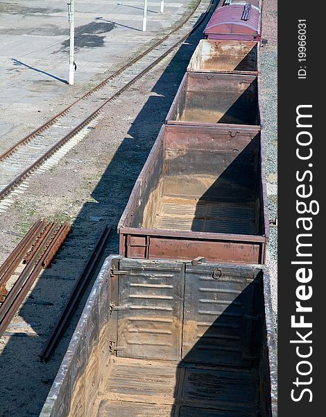 Empty open freight carriers on railroad