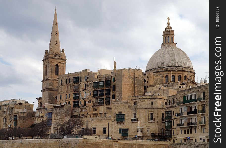 Historic Maltese architecture in the Valletta City on a cloudy day. Historic Maltese architecture in the Valletta City on a cloudy day.