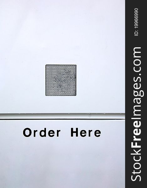 A speaker box and a sign saying order here