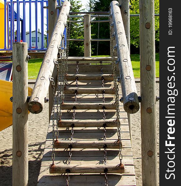 A wooden ladder on a childrens jungle gym. A wooden ladder on a childrens jungle gym