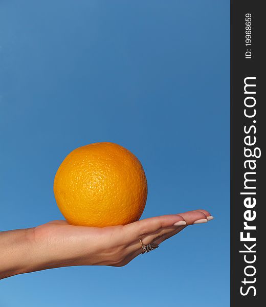 Orange in a female hand