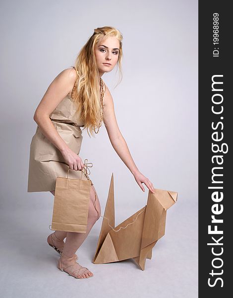 Woman wearing eco clothes stroking eco dog