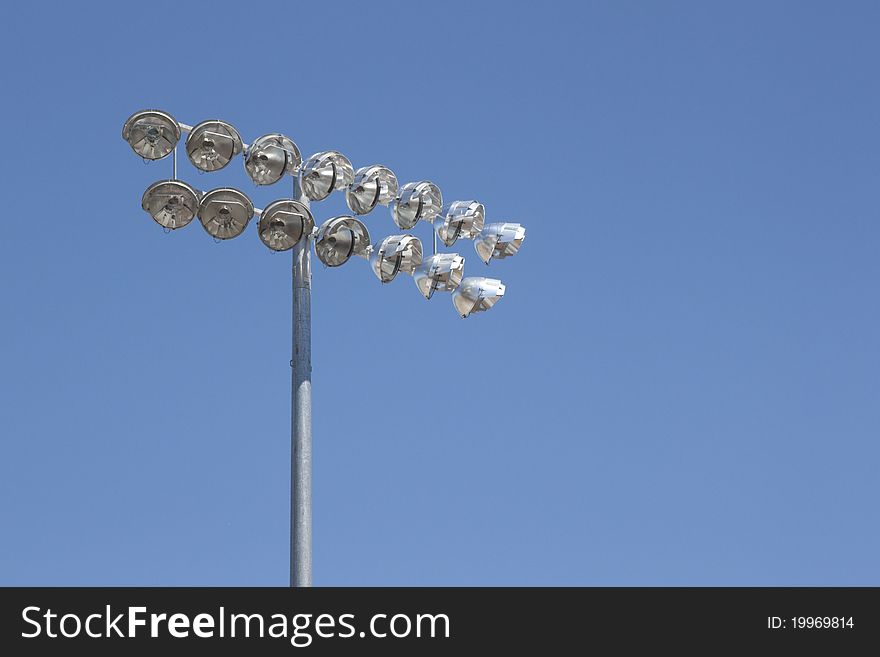 Stadium Lights On A Blue Sky Background
