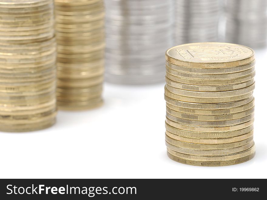 Stacks of coins isolated on white