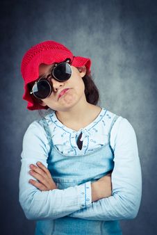 Little Girl In Red Hat And Sunglasses Disappointed Royalty Free Stock Photography