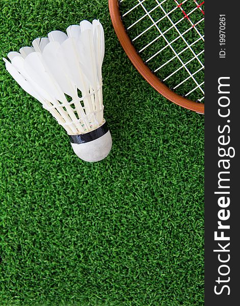 Shuttlecock and racket on court outdoor. Shuttlecock and racket on court outdoor