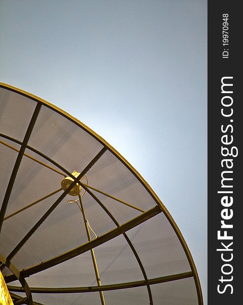 Satellite dish on blue sky background