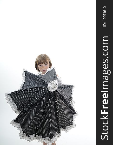 Freckled girl posing with accessory in studio. Freckled girl posing with accessory in studio