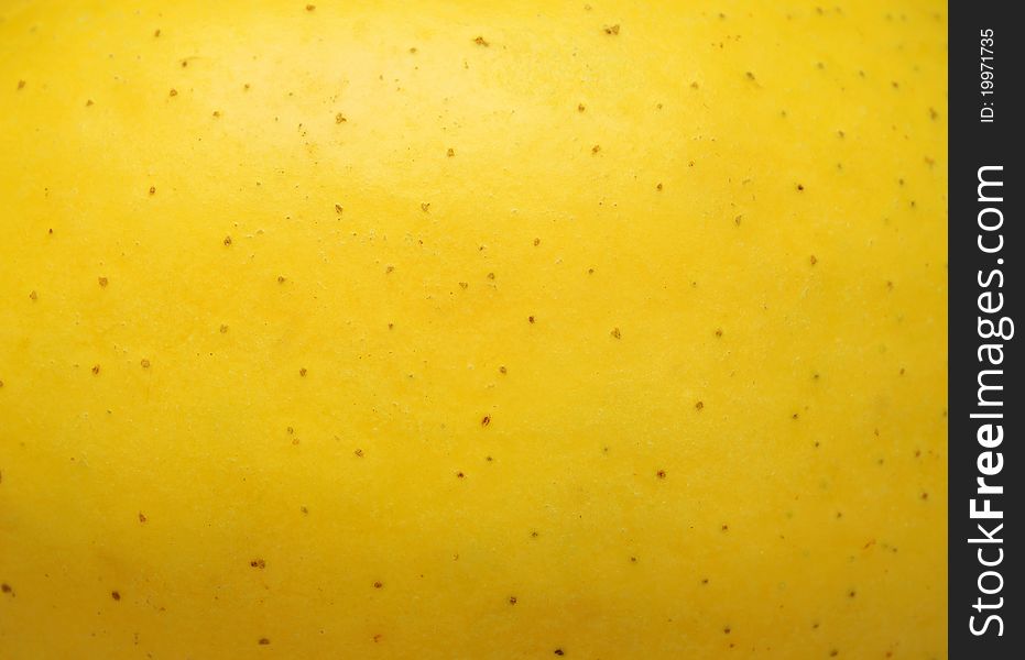 Background a yellow apple-close up