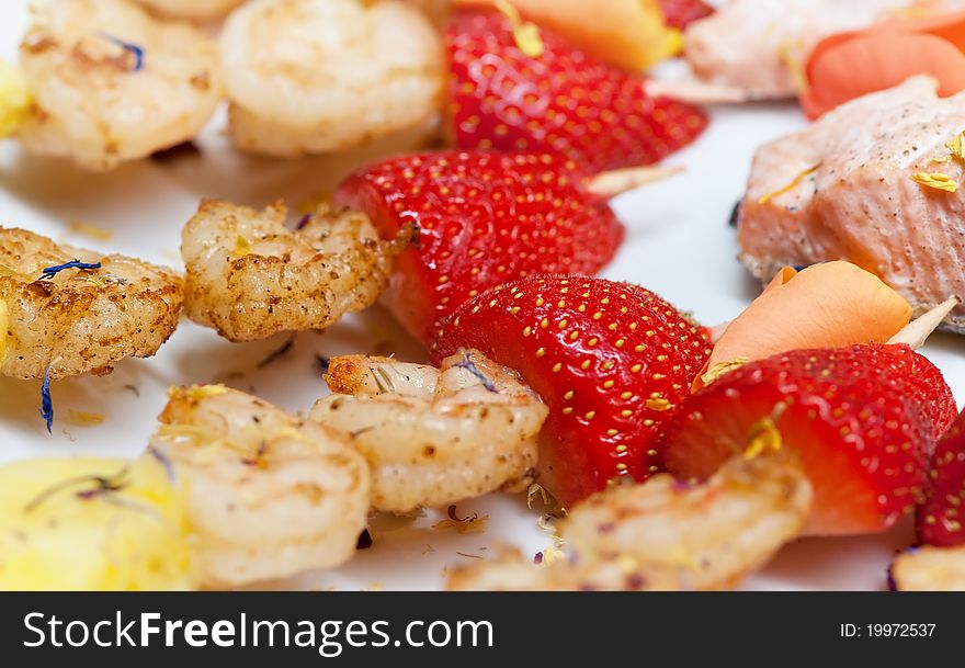 Delicious sticks with strawberries, pineapple and turkey