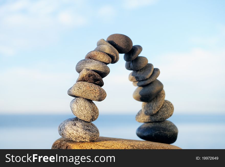 Arc crookedness of the pebbles on the seashore. Arc crookedness of the pebbles on the seashore