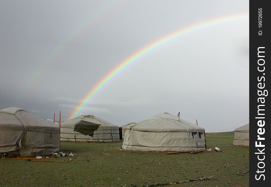 Rainbow above gers in a Mongolian steppe. Rainbow above gers in a Mongolian steppe