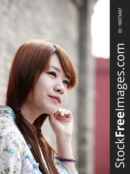 Chinese girl in traditional dress outdoor portrait. Chinese girl in traditional dress outdoor portrait.