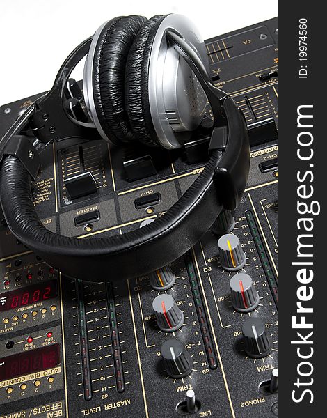 Professional DJ stereo headset on mixing controller. Professional DJ stereo headset on mixing controller