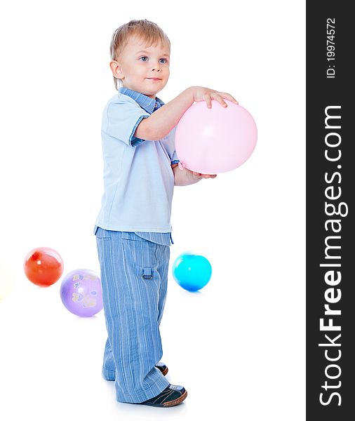 Little boy in balloons. Isolated on white background