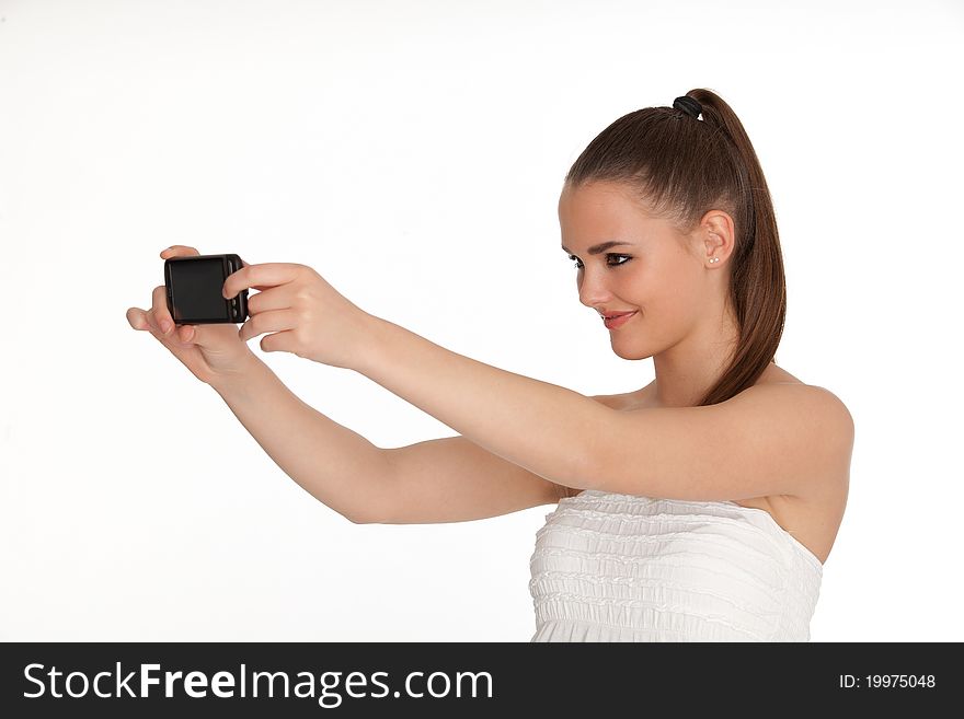Beautiful picture of brunette who has a mobile on a white background. Beautiful picture of brunette who has a mobile on a white background