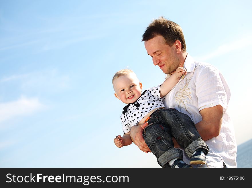 Father and take son in blue sky. Father and take son in blue sky