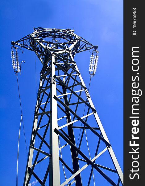 High voltage pylon and blue sky