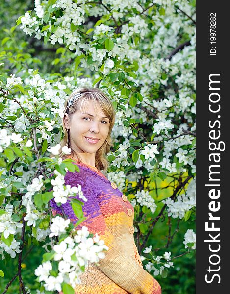 Woman near the blooming tree