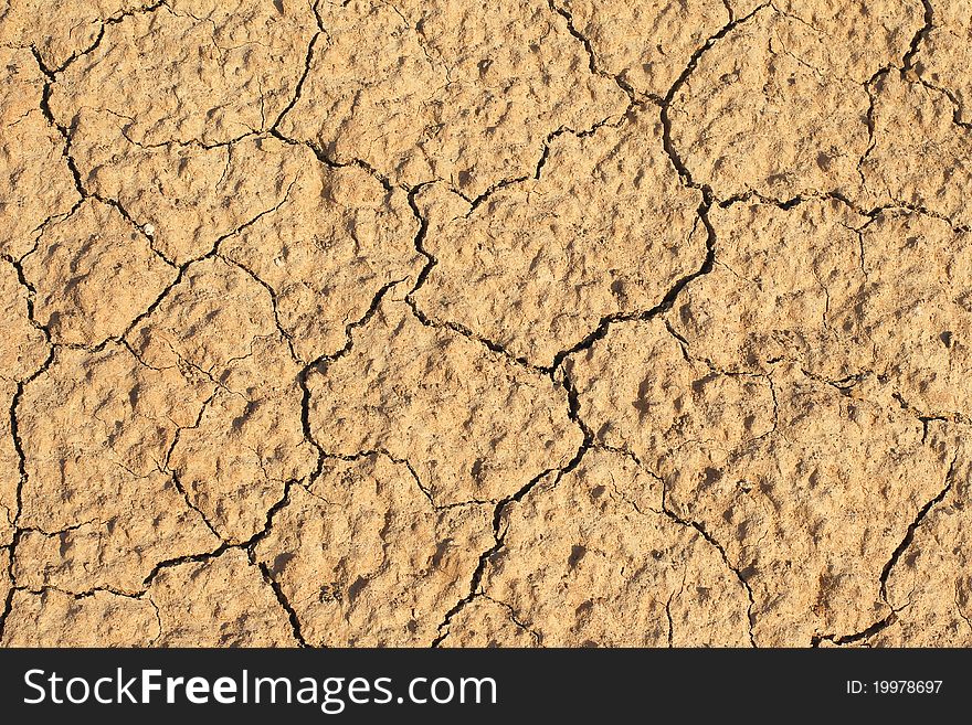 Clay earth in cracks from a drought. Clay earth in cracks from a drought