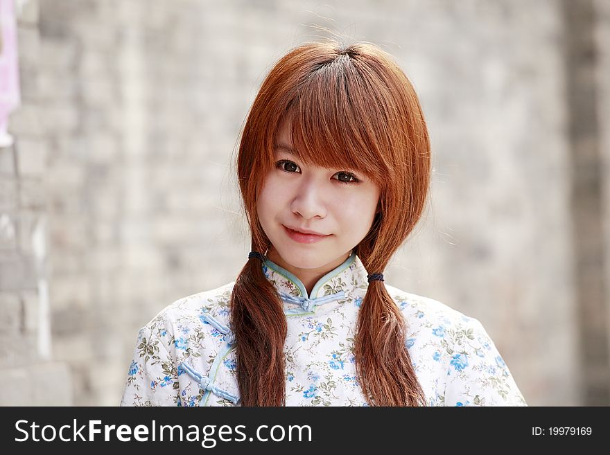 Chinese girl in traditional dress outdoor portrait. Chinese girl in traditional dress outdoor portrait.