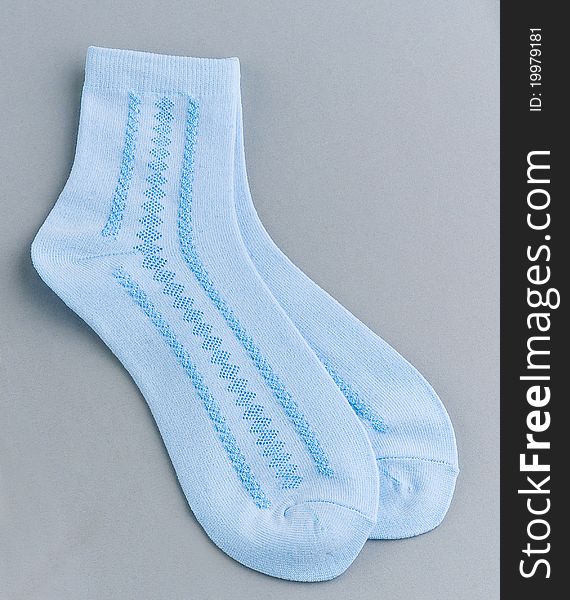 New light blue socks a nice pair footwear isolated. New light blue socks a nice pair footwear isolated
