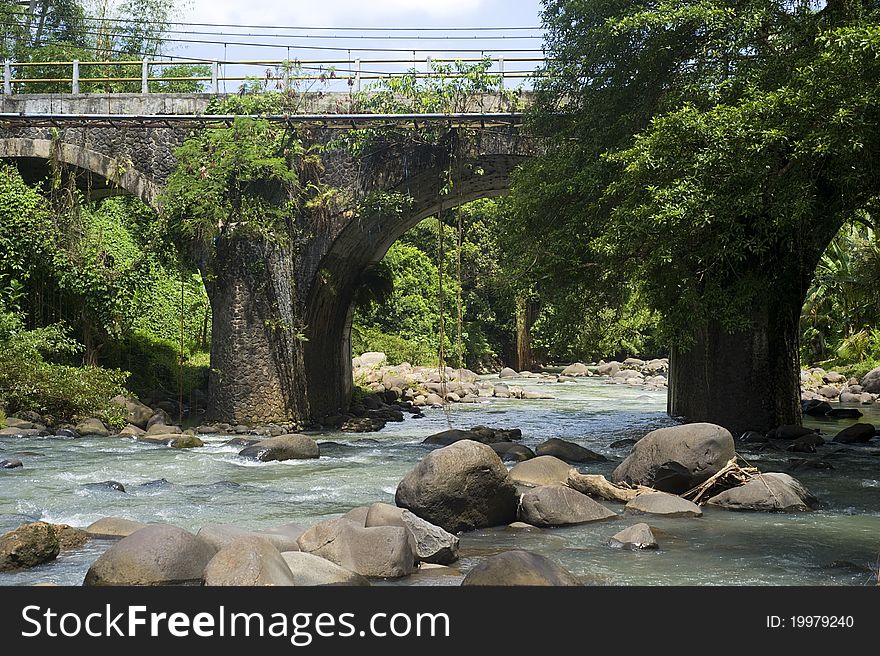 Bridge across the mountain river on Bali island, Indonesia. Bridge across the mountain river on Bali island, Indonesia