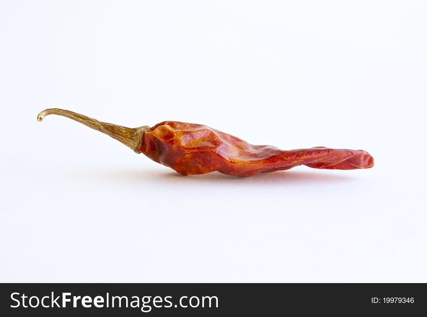 Dried red hot chili pepper, isolated on white background.