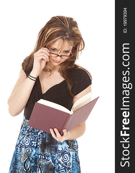 A woman looking down at her book reading. A woman looking down at her book reading.