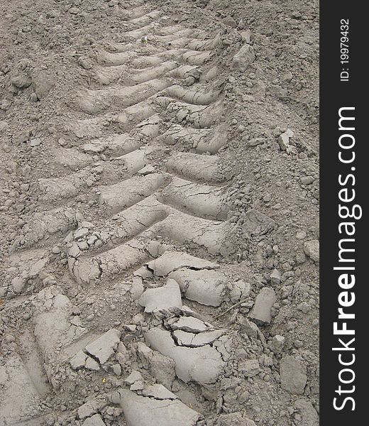 Track in the field made by a tractor