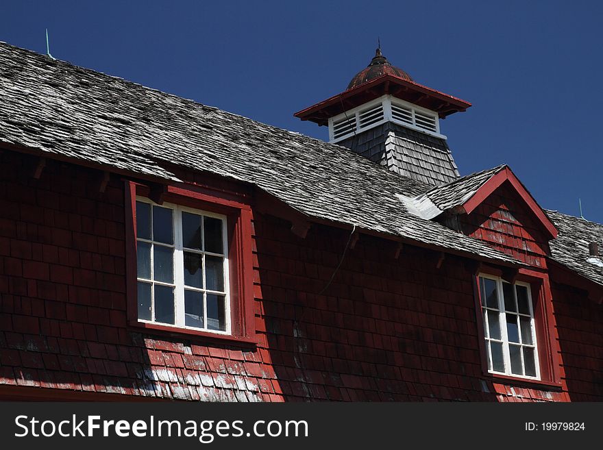 View of copula and dormer on an old barn. View of copula and dormer on an old barn