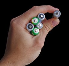 Hand Holding An AA Batteries Isolated On Black Stock Images Hand Holding An AA Batteries Isolated On Black Stock Images