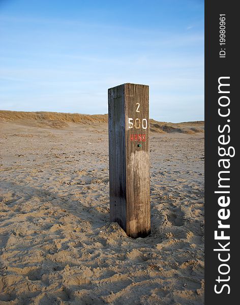 Pole marker on the beach