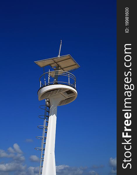 Lifeguard tower with blue sky in background