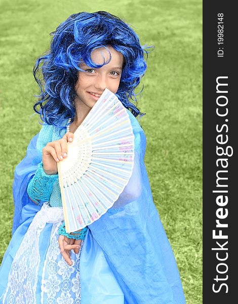 Portrait of the girl in blue wig. fairytale topic. Portrait of the girl in blue wig. fairytale topic