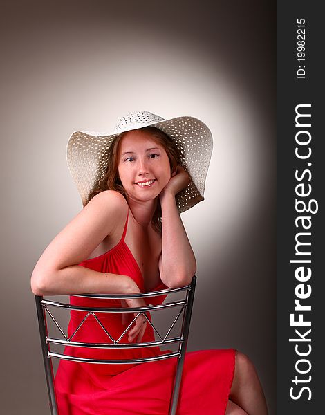 Lady in red with summer hat