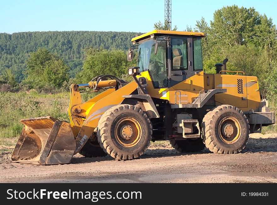 Close up of a excavator on a macadam