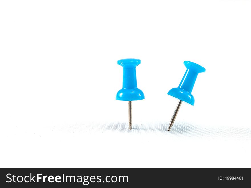 Close up of a pushpin on white background. Close up of a pushpin on white background