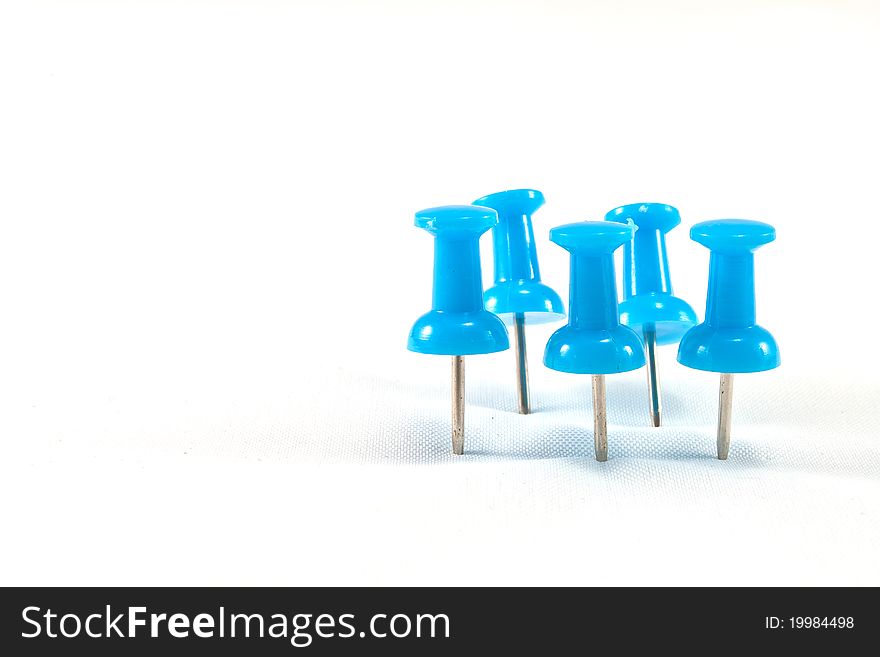 Close up of a pushpin on white background. Close up of a pushpin on white background