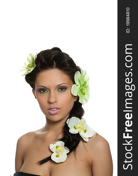 Attractive young beautiful natural model woman with orchid flower on head with hairstyle and eye makeup isolated over white background. Spring, summer girl, concept of healthy lifestyle metaphor. Attractive young beautiful natural model woman with orchid flower on head with hairstyle and eye makeup isolated over white background. Spring, summer girl, concept of healthy lifestyle metaphor